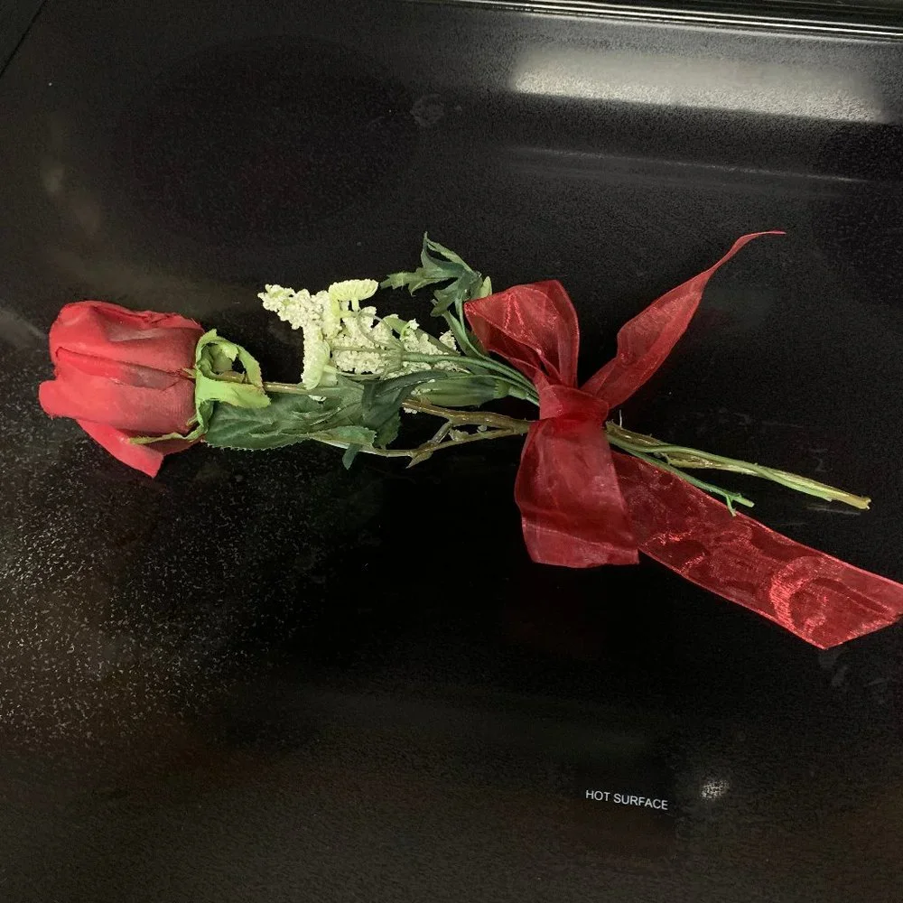 One Red rose with baby's breath and bow